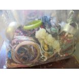 Three bags containing a large quantity of various costume jewellery