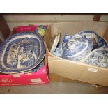 Two boxes containing a quantity of various English blue and white transfer printed dinner and tea