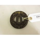 19th Century Japanese iron tsuba, cast with dragons, pierced decoration and traces of gilding,