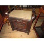 Late Victorian box seat piano stool with a carved fall front