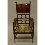 Arts and Crafts mahogany open arm chair of stylised design, the back transfer decorated with