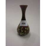 Christopher Dresser for Linthorpe pottery, a small narrow necked vase with honesty decoration on a