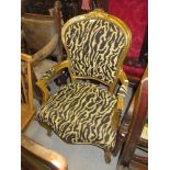 French carved giltwood open elbow chair upholstered in simulated tiger skin