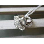 18ct White gold cluster ring set baguette and brilliant cut diamonds, approximately 1.25ct total