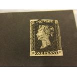 Penny Black postal stamp with three margins housed in a small pocket album