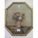 19th Century needlepoint picture, still life of fruits in a vase, 14.5ins x 12.25ins, octagonal gilt