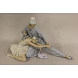 Lladro figural group of Pierrot and ballerina, 9.25ins high x 15ins wide In very good condition