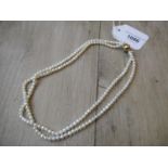 Two row freshwater pearl necklace with ball form 14ct yellow gold clasp