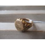 Early 20th Century 18ct gold signet ring engraved with conjoined initials and with carved shoulders,