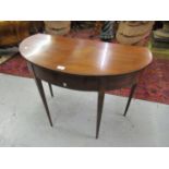 19th Century mahogany and line inlaid hall table with a single drop flap rising to form an oval 35.