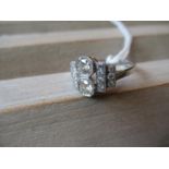 Art Deco style platinum ring set with two central diamonds and twin diamond set shoulders, 0.80ct