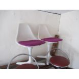 Pair of Arkana tulip chairs, the moulded seats above white painted alloy bases