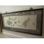 Chinese silk picture of birds in foliage in a patterned border, hardwood framed, 18ins x 39.5ins,