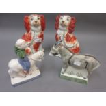 Pair of 19th Century Staffordshire figures of seated spaniels together with two Rye pottery