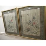 Pair of 20th Century Chinese silk pictures of insects and flowers within patterned borders, gilt