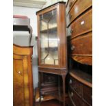 Small Edwardian mahogany and line inlaid standing corner cabinet with a bar glazed door enclosing