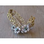 18ct Two colour gold floral spray brooch set emeralds and diamonds