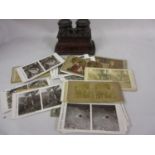 Small Victorian figured walnut stereoscope together with a quantity of cards