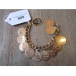 Gold plated charm bracelet with seven gold and other gold plated identity discs