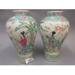 Pair of Chinese Canton enamel vases decorated with figures, 8.5ins high