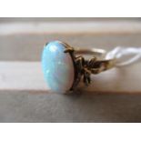 9ct Gold and opal set ring with bow design shoulders Size L/M There is a chip to the opal - see