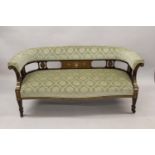 Edwardian rosewood and marquetry inlaid drawing room sofa, the rolled back and overstuffed seat