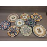 Quantity of various Continental floral painted pottery wall plates