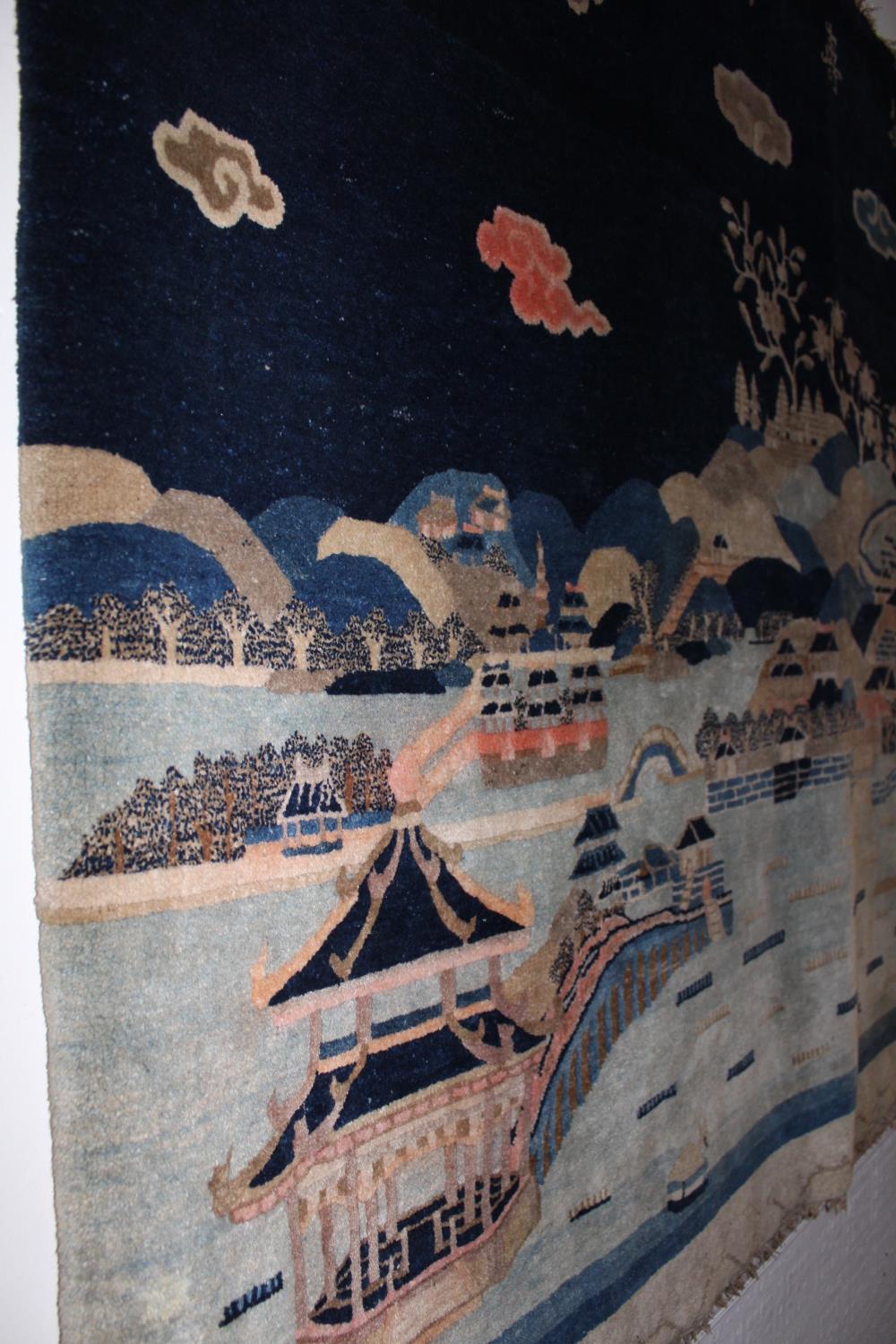 Chinese rug woven with a landscape design in shades of blue, pink and beige beneath a row of seven - Image 3 of 10