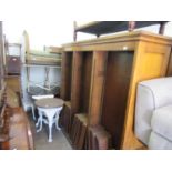 Pair of early 20th Century oak double sided open bookcases, the moulded cornices above adjustable