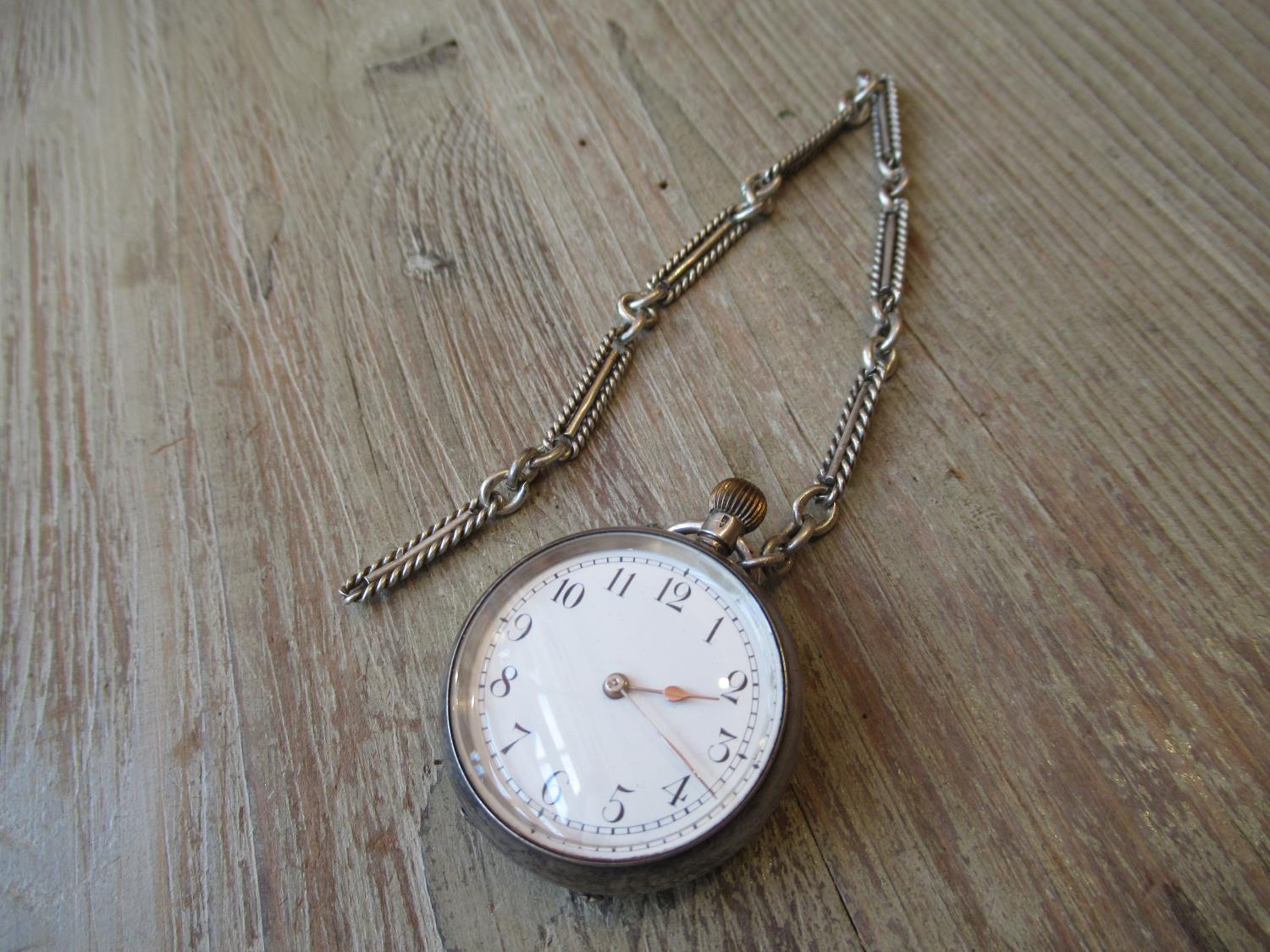 Small silver cased Victorian fob watch with white enamel dial having Arabic numerals and alternating