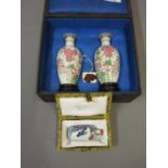 Pair of mid 20th Century Chinese porcelain miniature baluster form vases decorated in famille rose
