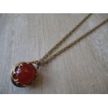 Cornelian sphere pendant on a 9ct gold chain