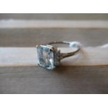 Art Deco style platinum ring set central aquamarine and diamond set shoulders, 0.12 / 2.15cts