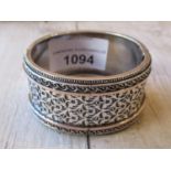 Victorian floral etched white metal bangle Some small dents to the plain rear section and one in