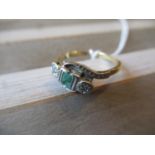 18ct Yellow gold emerald and diamond ring of crossover design