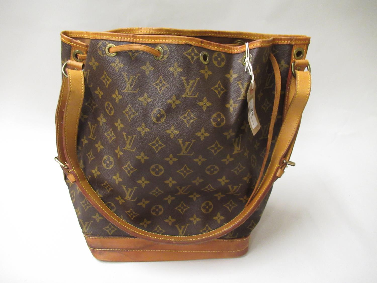 Louis Vuitton, ladies bucket bag with leather strap and leather tie top Some staining to base and
