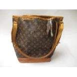 Louis Vuitton, ladies bucket bag with leather strap and leather tie top Some staining to base and