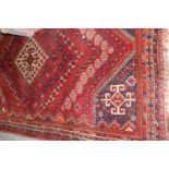 Shiraz rug of centre medallion and all-over geometric floral design with borders, approximately