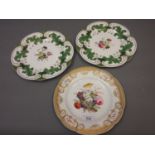 Pair of Rockingham type cabinet plates painted with floral sprigs within green and gilt borders,