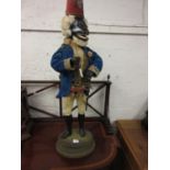 Large musical automata in the form of a smoking monkey wearing a fez, blue velvet jacket and kid