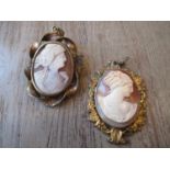 Two cameo pendants carved with portraits of ladies in profile