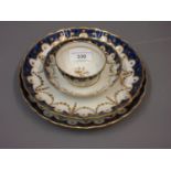 Two Newhall blue and gilt plates, 8.5ins and 8.25ins respectively, together with a similar tea