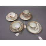 Late 18th Century English porcelain trio decorated in gilt and sepia, two similar Worcester cups and