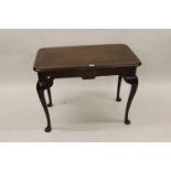 Rectangular mahogany side table, circa 1900, the moulded top raised on carved cabriole supports with