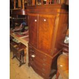 Good quality reproduction mahogany and crossbanded cocktail cabinet, the moulded cornice above two