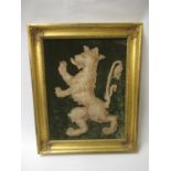 Antique cut-out textile fragment of a lion rampant mounted on a velvet backing, 19ins x 14ins