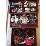 Jewellery box containing a quantity of various costume jewellery including brooches