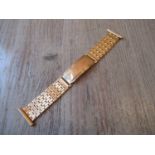 9ct Yellow gold watch bracelet 22.5g. The catch has a slide adjustment. Minimum length is 12.8cms,