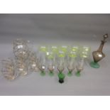 Set of nine pale green tinted champagne or cocktail glasses with hollow faceted stems and circular