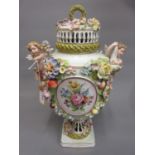 Large late 19th Century Continental porcelain floral encrusted baluster form vase and cover with